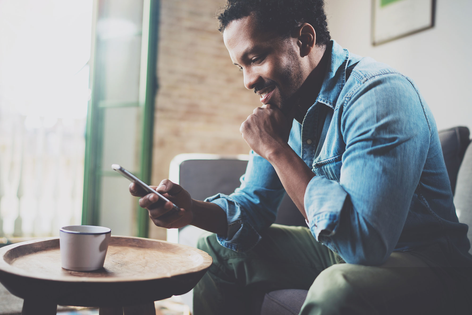 Man reading smartphone